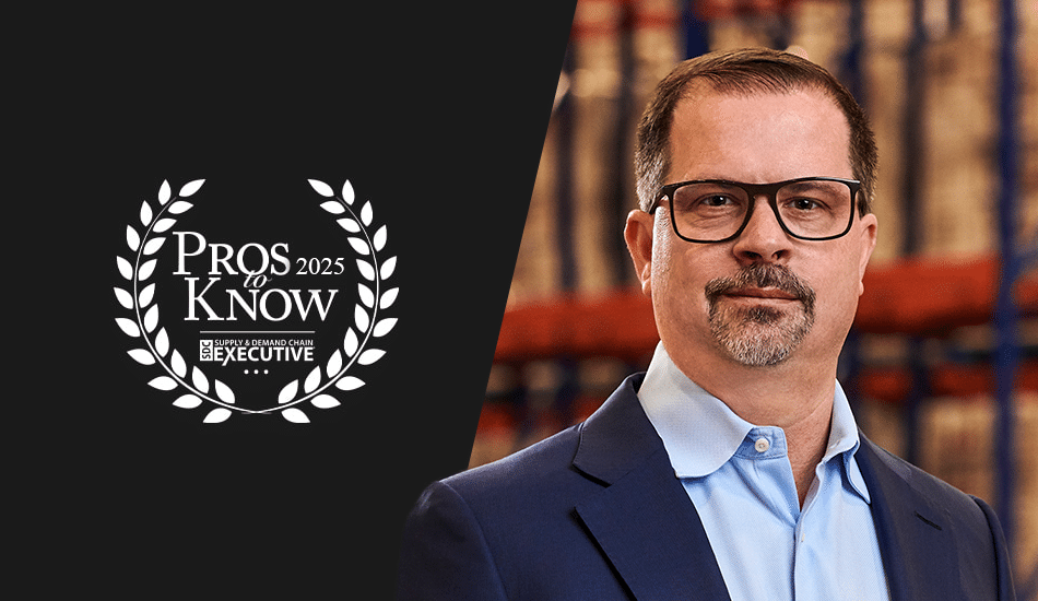 Portrait of a man with glasses, wearing a blue suit and white shirt, next to a 